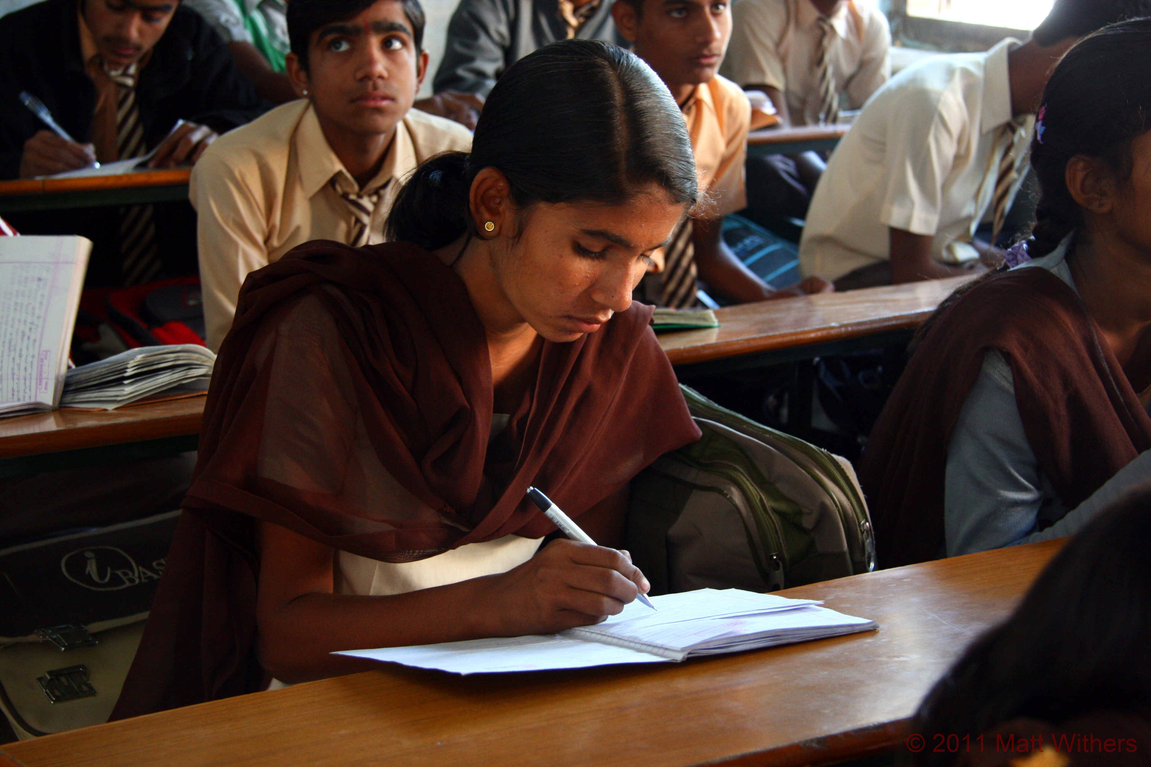 A young girl hard at work during her lesson at school