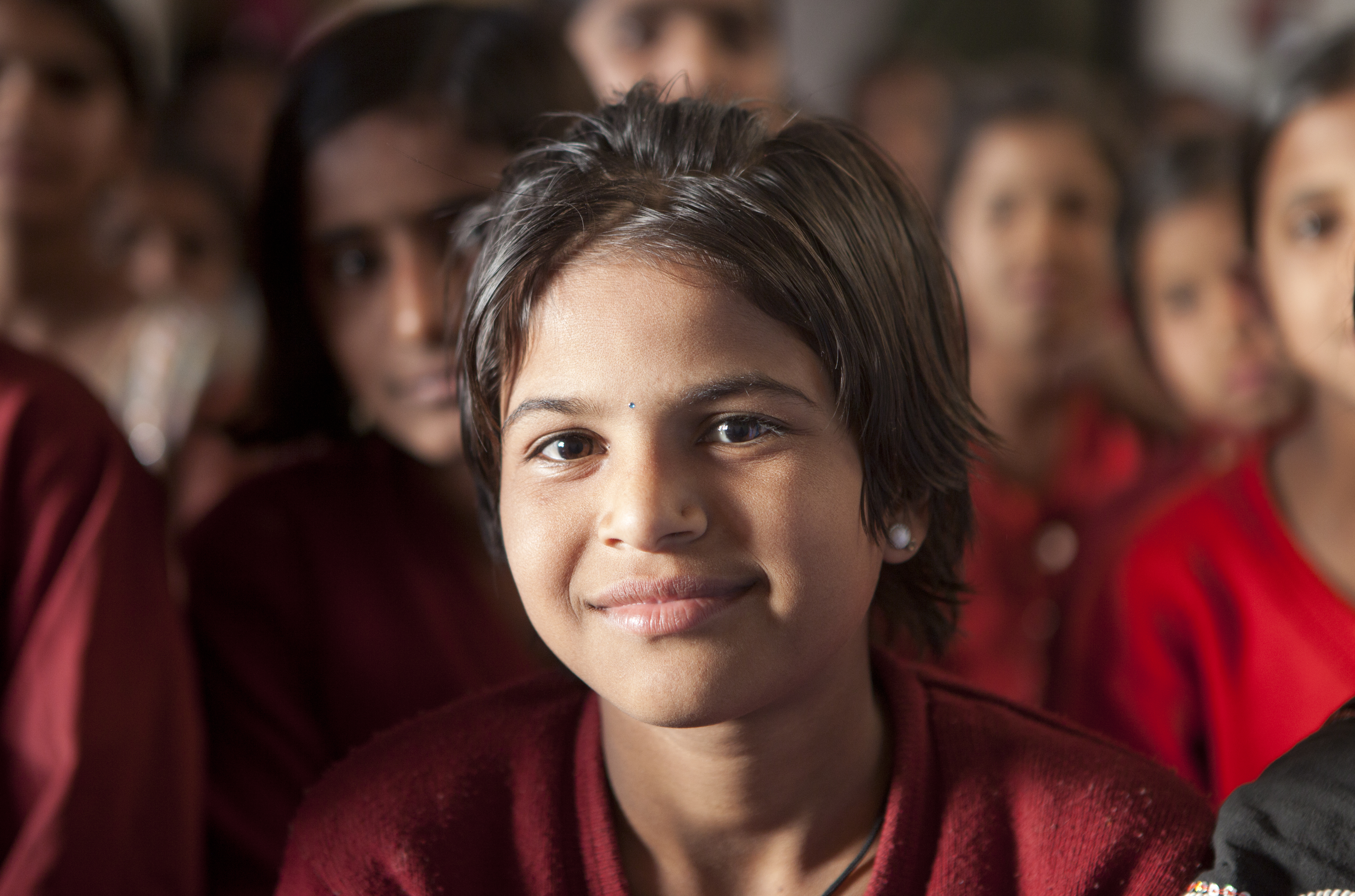 A young school girl enjoying her education by Mark Tuschman