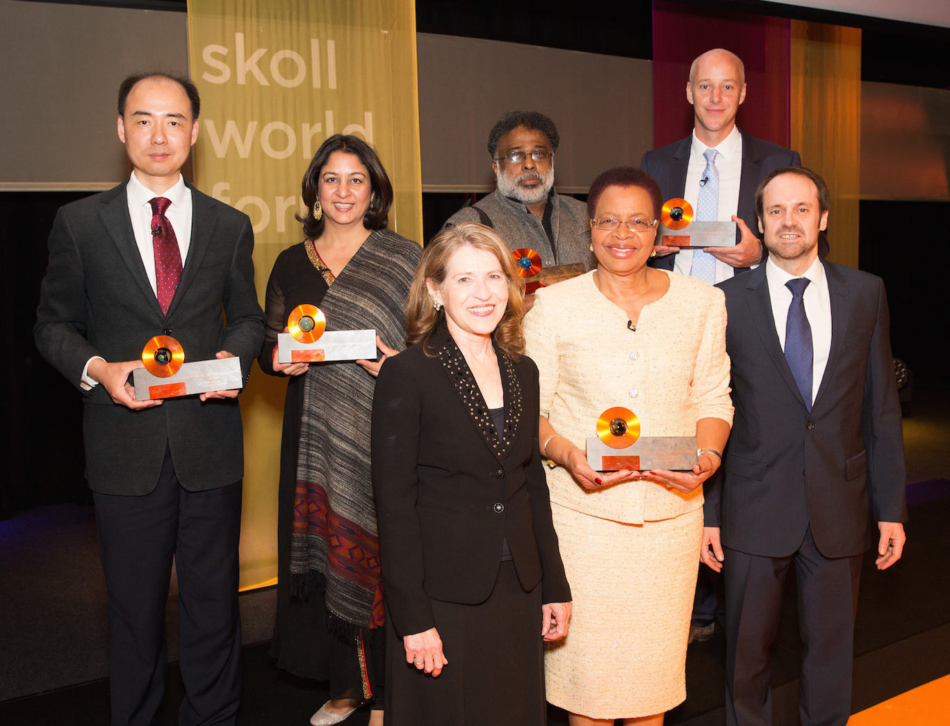 2015 Skoll Award for Social Entrepreneurship Winners, from left to right, back row, Ma Jun, Executive Director and Founder of Educate Girls Safeena Husain, Jagdeesh Rao Puppala & Al Harris, joined on the front row, from left to right, by Sally Osberg, Graça Machel & Jeff Skoll.